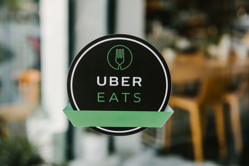 Uber Eats Sign on the Door of a Restaurant