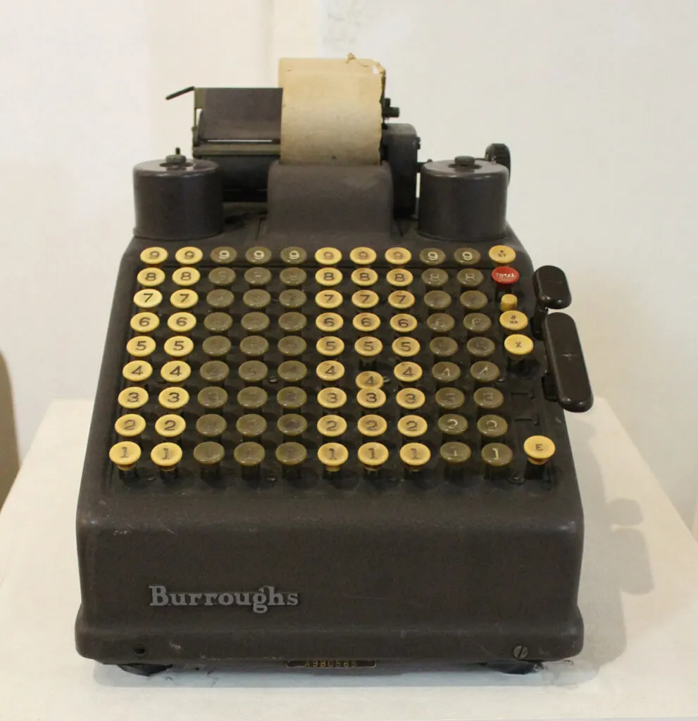 Old Burroughs adding machine on display at a museum.