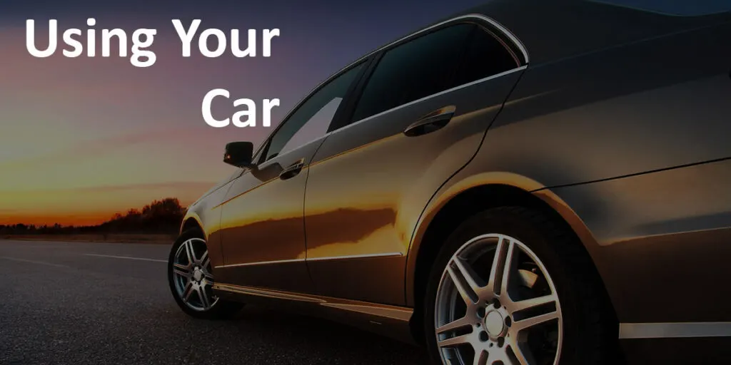 "Using Your Car" label over image of a newer car driving into a sunset