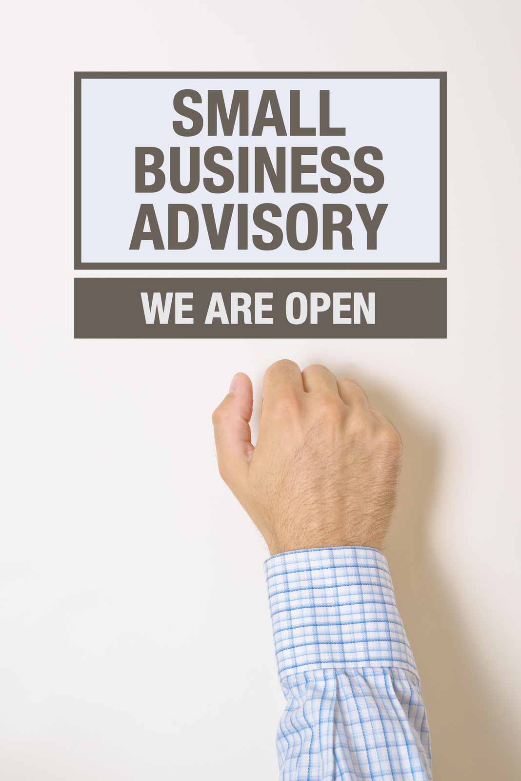 A person knocking on a door with the sign Small Business Advisory: We are Open.