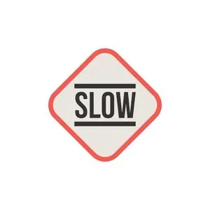 Drawing of a diamond shape road sign that says Slow.