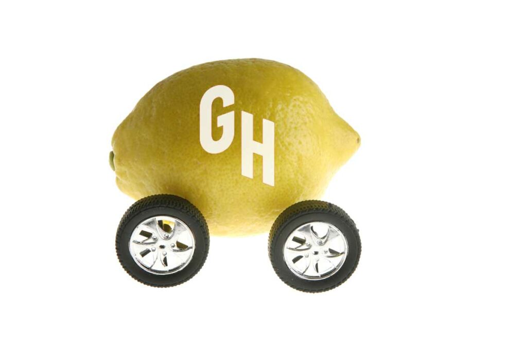 A lemon with the Grubhub logo on it on wheels illustrating Grubhub as a lemon.