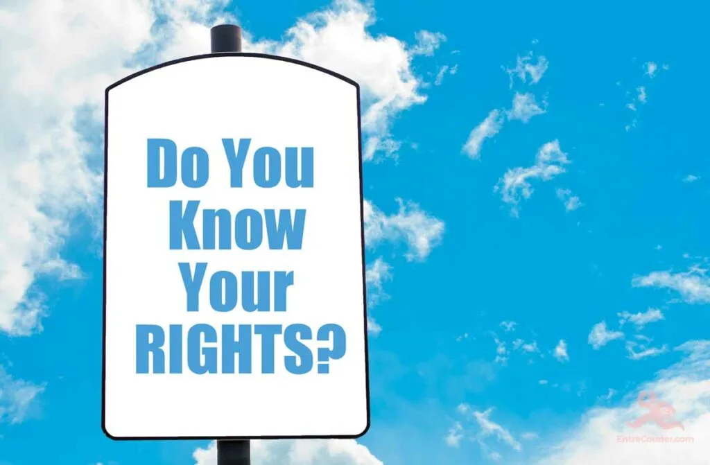 Blue sky with whispy clouds in the background, with a sign in the foreground that says Know your rights.