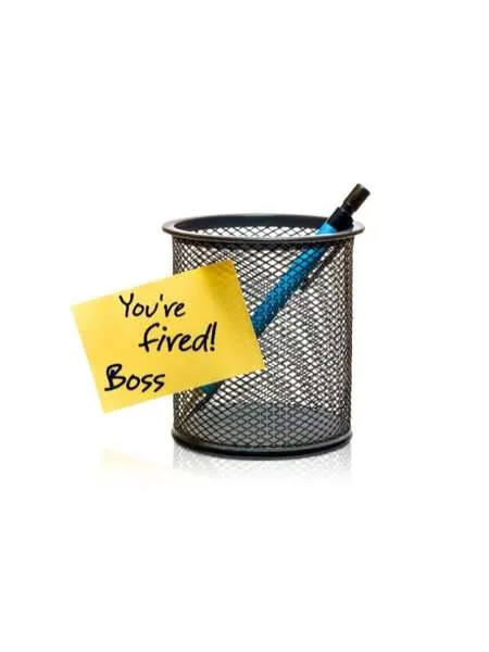 A pencil holder with a single pencil and a yellow sticky note that reads you're fire! Boss.