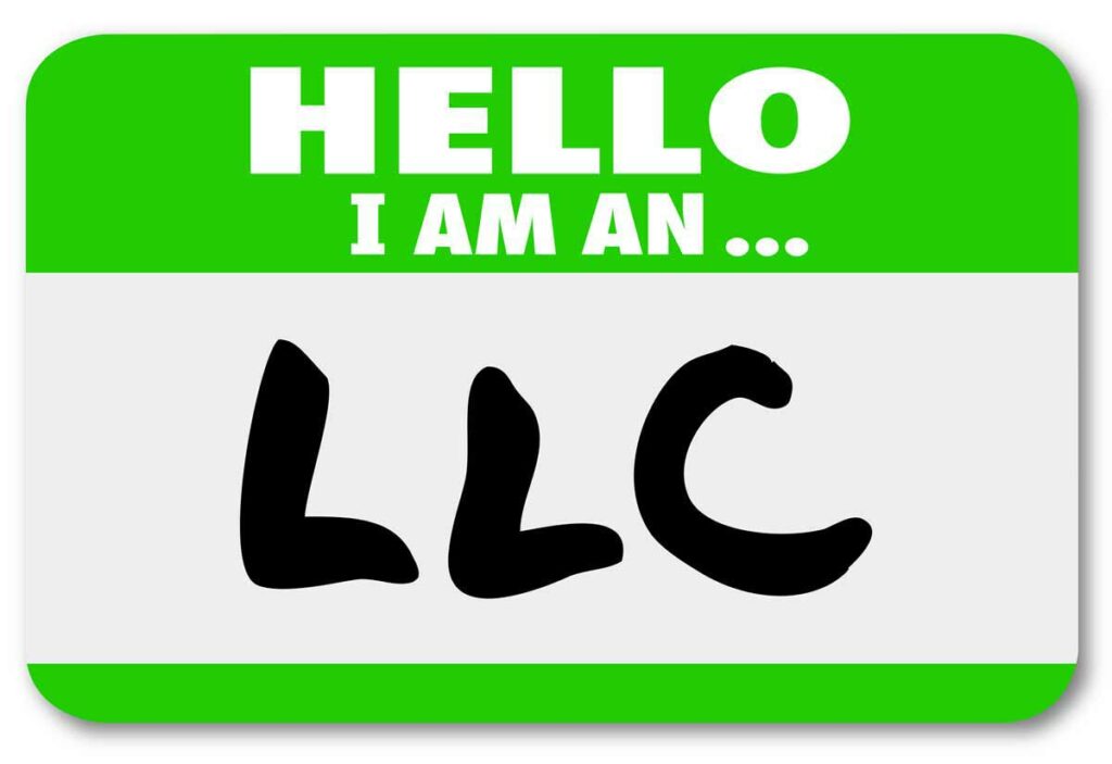 Green and white name tag that reads Hello I am an LLC.